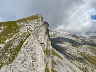 Alpine peaks Chli Hohmad (2492 m) and Gross Hohmad (2307 m) above the Tannensee lake (or Tannen lake) and in the Uri Alps mountain massif, Melchtal - Canton of Obwalden, Switzerland (Kanton Obwald)