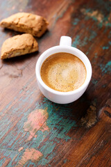Cup of coffee and Cantuccini (Italian cookie) on dark wooden background. Copy space.