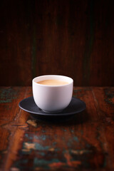 Cup of coffee on wooden background. Soft focus. Copy space