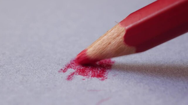 Red Color Pencils. Close-up of Colored Pencils Red pencil lines on a white paper background, macro