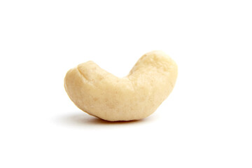 Close-up of a single raw cashew nut with a creamy, curved shape. Isolated on a white background,...
