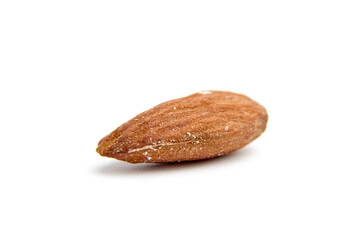Close-up of a single whole almond nut with a natural brown shell texture. Isolated on a white background, perfect for healthy snack and nutrition concepts