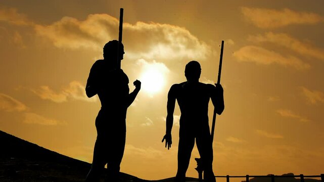 Guanche: timelapse of backlit statues representing warriors in Fuerteventura