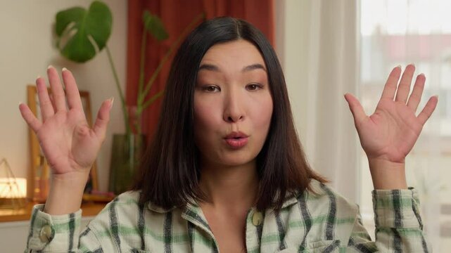 Portrait Asian Korean Chinese Japanese woman make mind explosion gesture female girl businesswoman wife housewife home indoor difficulties problem showing head boom idea mortgage business householder