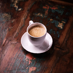 Cup of coffee on wooden background. Soft focus. Copy space	