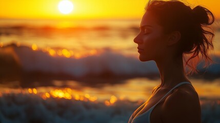 Peaceful woman meditating by the ocean at sunset, eyes closed, embracing mindfulness, relaxation, and inner balance with golden sunlight.