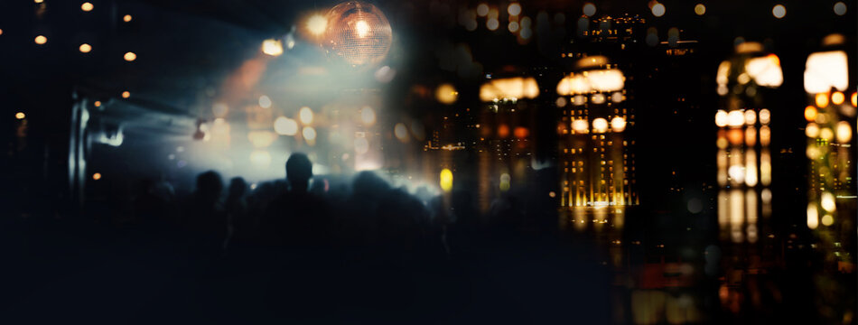Shadow of people in party with blur orange lamp light at bar in the city night banner background