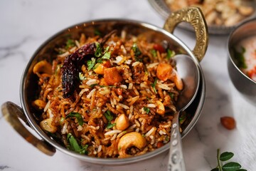 Tamarind rice or Puliyogare | Puliyodharai served with yogurt, selective focus