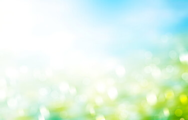 Fototapeta premium Green grass blue sky blurred background stock photo. Rainbow blur easter background wallpaper stock illustrations.