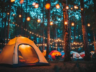 Poster Colorful camping tents illuminated by string lights at a lively music festival in the evening