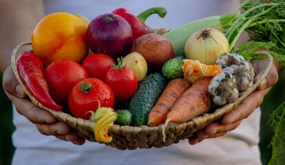 man holding fresh vegetables in his hands. Selective focus