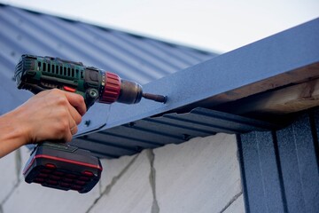 man repairing roof. Selective focus
