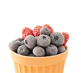 Mixed summer frozen berries in a bowl on a white background. copy space