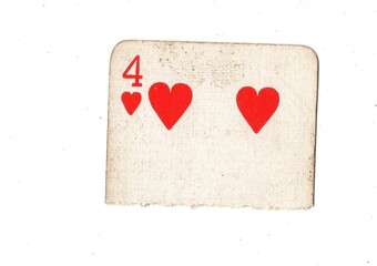 A torn half of a well used vintage playing card on a white background.