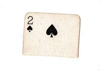 A torn half of a well used vintage playing card on a white background.