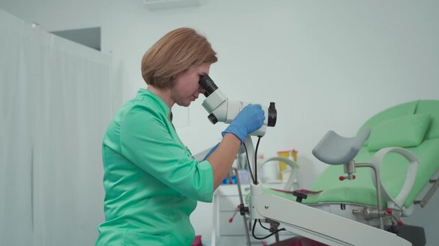 Gynecologist uses colposcope, optical device with magnification for detailed examination of cervix, vagina and vulva, helping to diagnose pathologies, detect precancerous changes. Women health. 