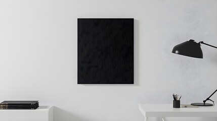 Minimalist Black Poster Frame on White Wall with Table and Lamp