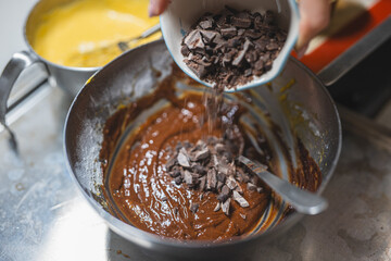 Home preparation of chocolate cakes and brownies using egg flour, chocolate chips, holiday activity, happiness, low sugar healthy lifestyle