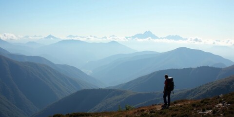 Fototapeta premium vast mountain landscape, with layers of rolling hills stretching into the distance. Low-hanging clouds hover above the peaks, while a lone backpacker stands with his back to the camera,