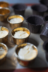 Baking process of chocolate vanilla cupcake dessert, meditation, healthy organic low sugar diet, small bakery, home baking, self care and happiness, batter in stainless steel spoon