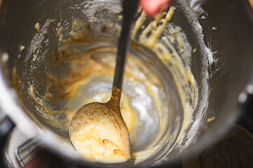 Home Low Sugar Party Baking Mixture in a mixing bowl,rustic and messy home kitchen