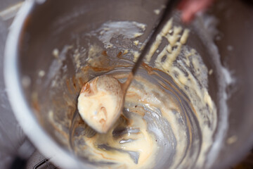 Home Low Sugar Party Baking Mixture in a mixing bowl,rustic and messy home kitchen