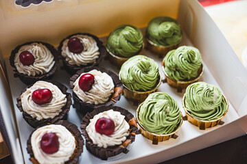 Chocolate cherry and matcha flavored cupcakes, exquisitely packaged in paper boxes, small baking business, organic low sugar cakes for parties and gatherings,cream top