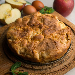 Delicious cinnamon cake with fresh apple pieces. Traditional German recipe.