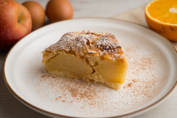 Delicious cinnamon cake with fresh apple pieces. Traditional German recipe.