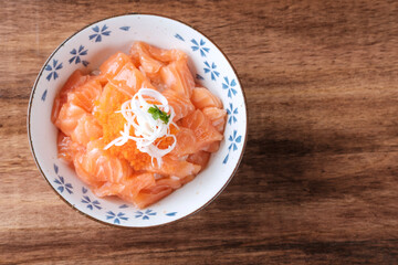 Salmon Sashimi Served with Rice on Bowl.