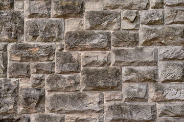 Close up of a dry stone wall texture. Stone Wall Background