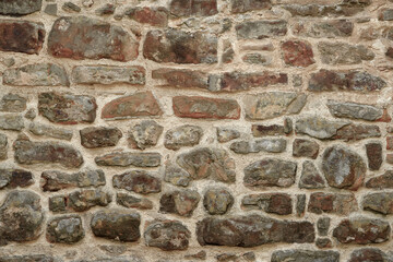 Close up of a dry stone wall texture. Stone Wall Background