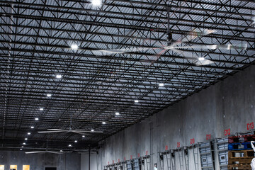 interior of a modern warehouse with large ceiling fans