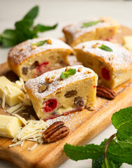 Delicious white chocolate brownie with walnuts and raspberries.