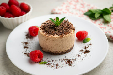 Delicious chocolate mousse cake with raspberries.
