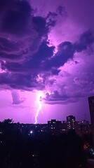 Dramatic lightning over city at night