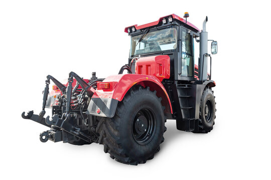 Red heavy wheeled tractor isolated