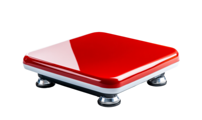 Shiny red square button on a sleek surface.