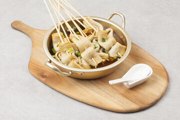  Fish cake soup is a food made by crushing fish flesh, adding additional ingredients such as salt, and cooking it to coagulate it.