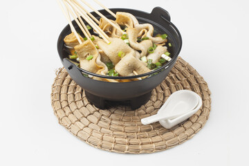  Fish cake soup is a food made by crushing fish flesh, adding additional ingredients such as salt, and cooking it to coagulate it.