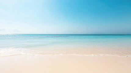 Fototapeta premium serene empty sandy beach under clear blue sky sunlight gently shimmering on tranquil ocean waves