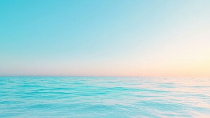 Obraz premium vast and serene ocean horizon under clear blue sky where sea meets sky seamlessly with warm gentle golden light tranquil