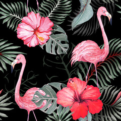 Seamless pattern of the flamingo and hibiscus flowers on black background.Painting with watercolors.Designed for fabric luxurious and wallpaper, vintage style.The composition of tropical plants.