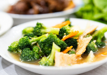 Chinese mix fried bean curd with broccoli