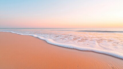 Obraz premium serene beach at sunrise with gentle waves lapping at shore golden sand glistening under soft morning light