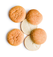 Empty burger bun with sesame seeds isolated on white background.