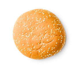Empty burger bun with sesame seeds isolated on white background.