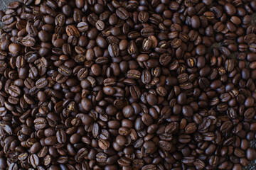 Roasted coffee beans brown seeds texture background wallpaper.