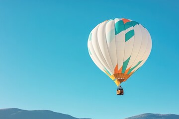 Fototapeta premium vibrant hot air balloon soars gracefully against clear blue sky showcasing its intricate patterns and vivid colors