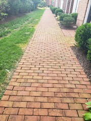 Red brick walkway. A sidewalk or path. Convenience and comfort.